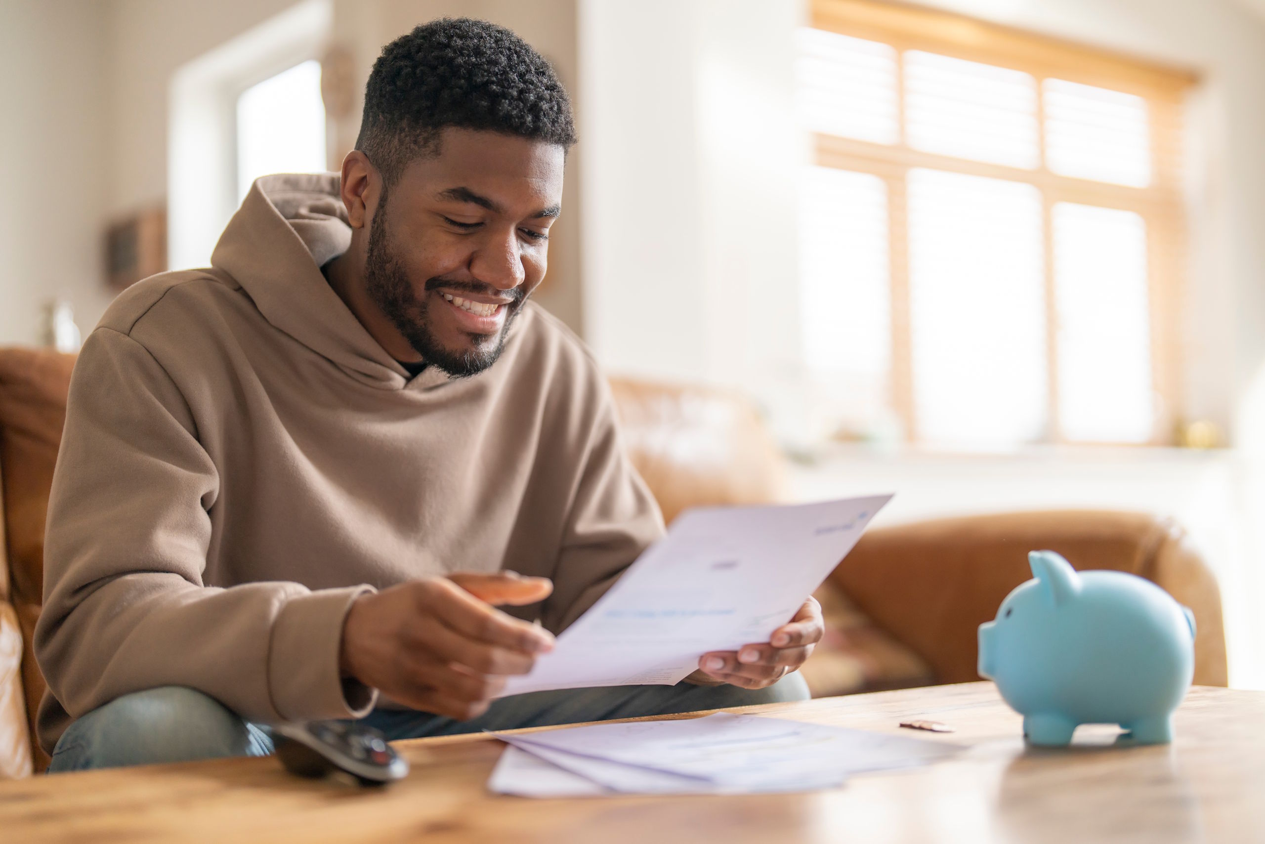Homeowner reviewing HVAC financing paperwork at home