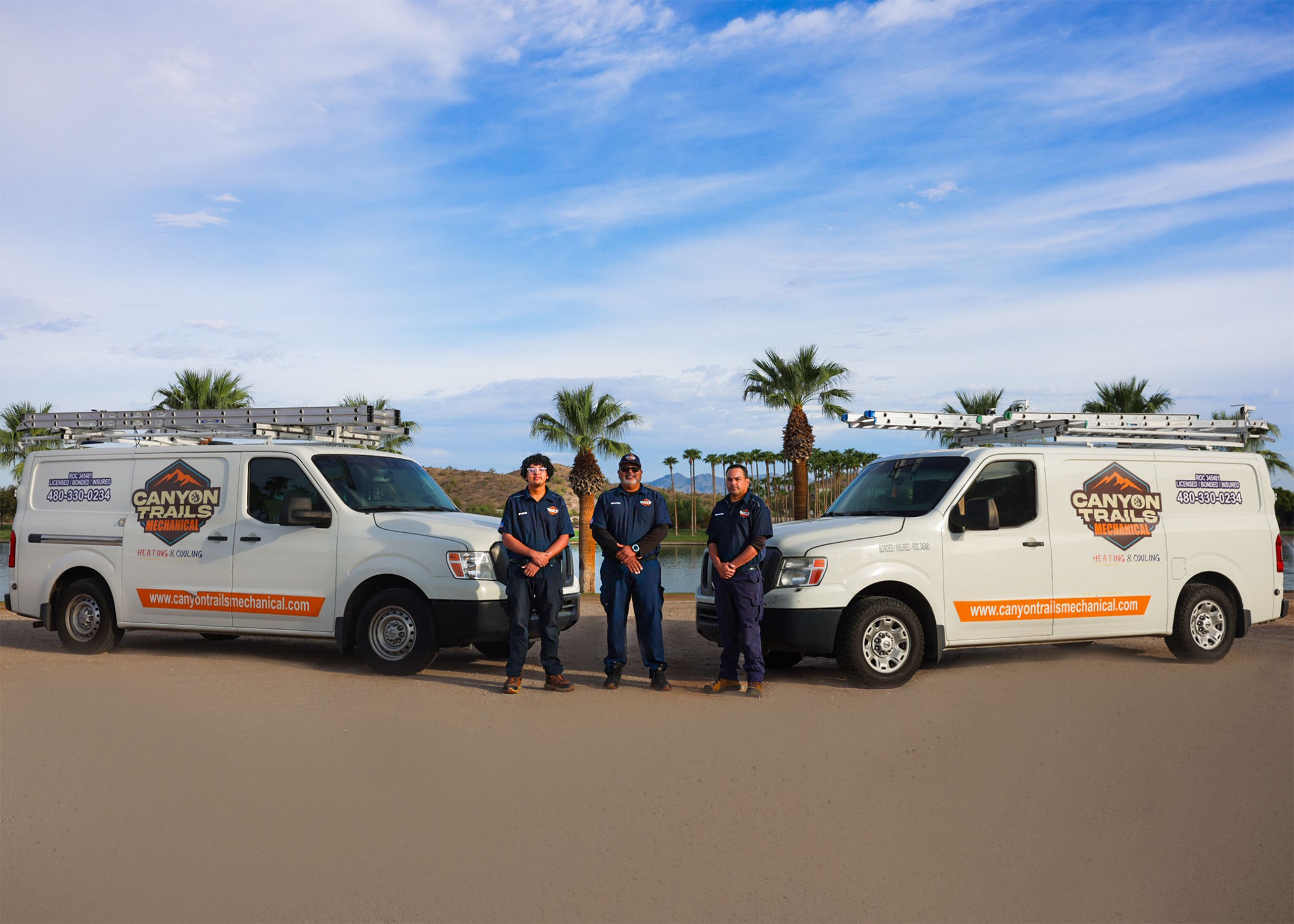 The Canyon Trails Mechanical team standing with their service vans